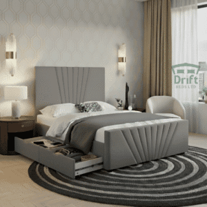Grey Gisborne Divan bed with one drawer open, showcasing the integrated storage and the stunning fan-pleated headboard and footboard.