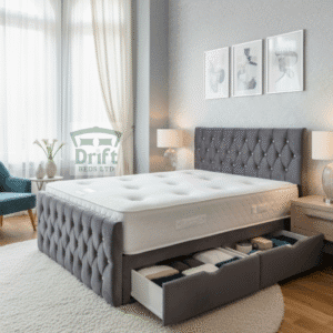 The Aspire divan bed in a plush charcoal grey velvet, with two large side drawers pulled out to showcase its convenient and integrated storage solution.