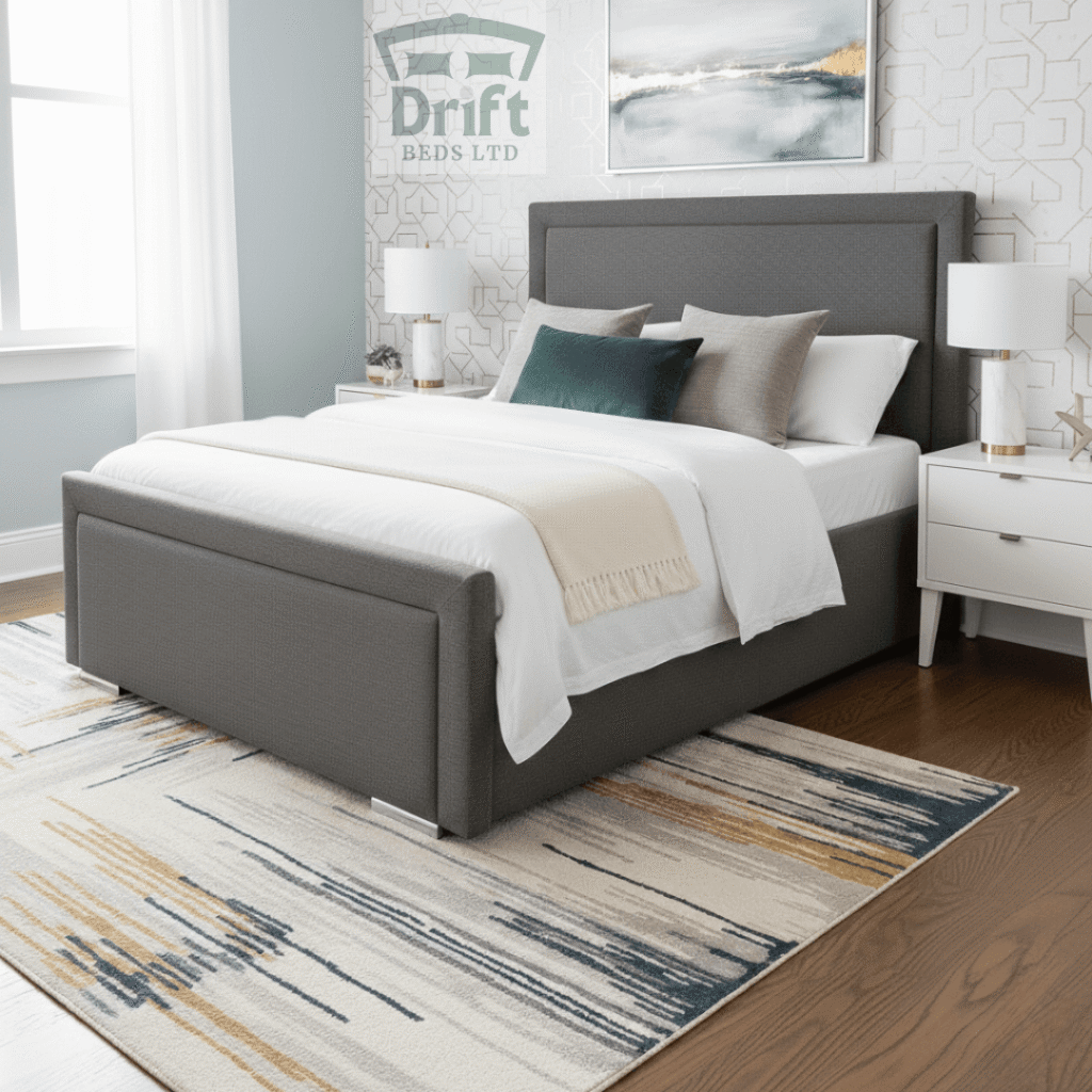 The Charlie Modern Upholstered Grey Divan Bed Frame Bordered Headboard The Charlie bed in a sleek charcoal grey finish, showing its smart bordered design and practical foot-end drawer storage.