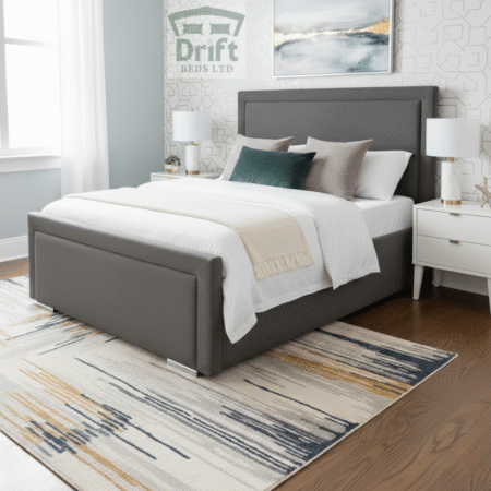 The Charlie bed in a sleek charcoal grey finish, showing its smart bordered design and practical foot-end drawer storage.