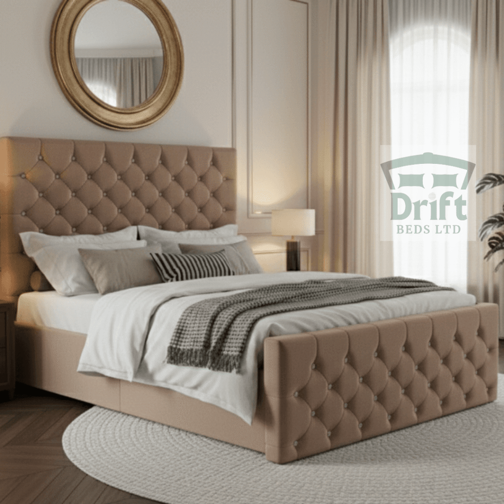 The luxurious Chesterfield divan bed in a soft mink fabric, highlighting its warm tones and the convenience of its built-in drawers.
