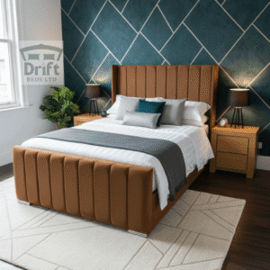 The handsome Clarence Wingback divan bed in a rich mink, highlighting its tall, panelled frame and smart storage drawers.