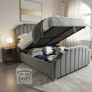 The glamorous Empress ottoman bed in grey, with the mattress effortlessly lifted to showcase the deep and spacious internal storage compartment, perfect for luxury living.