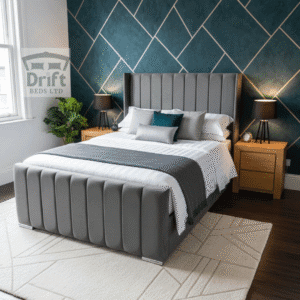 The sophisticated Clarence Wingback ottoman bed in a chic grey velvet, lifted to showcase its expansive hidden storage.