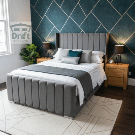 The sophisticated Clarence Wingback ottoman bed in a chic grey velvet, lifted to showcase its expansive hidden storage.