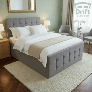The chic Raven ottoman bed upholstered in a versatile grey textured fabric, lifted to showcase its expansive hidden storage.