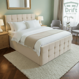 The Raven standard bed frame in a warm cream fabric, featuring its modern square panelled headboard and footboard, adding a cozy yet sophisticated touch.