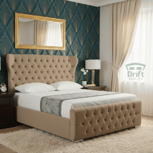 The handsome Robin Wingback bed in a deep mink velvet, highlighting its tufted wingback frame and smart storage drawers.