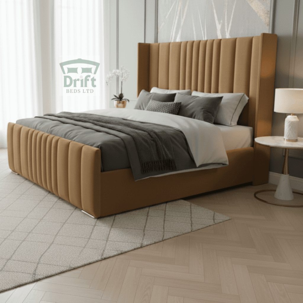 The handsome Rome Wingback divan bed in a rich mink, highlighting its tall, panelled frame and smart storage drawers.