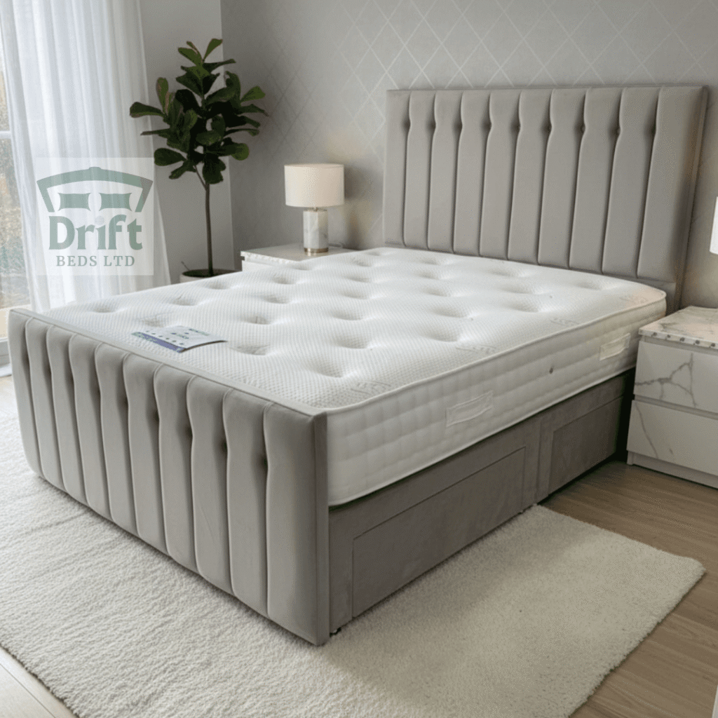 The Sparrow divan bed in a sophisticated light grey, showing the deep drawers that offer ample and convenient bedroom storage.