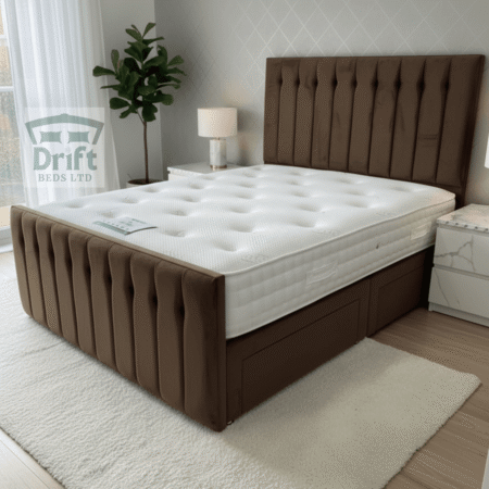 The sophisticated Sparrow divan bed in a rich mink, highlighting its plush vertical panels and smart drawer storage.